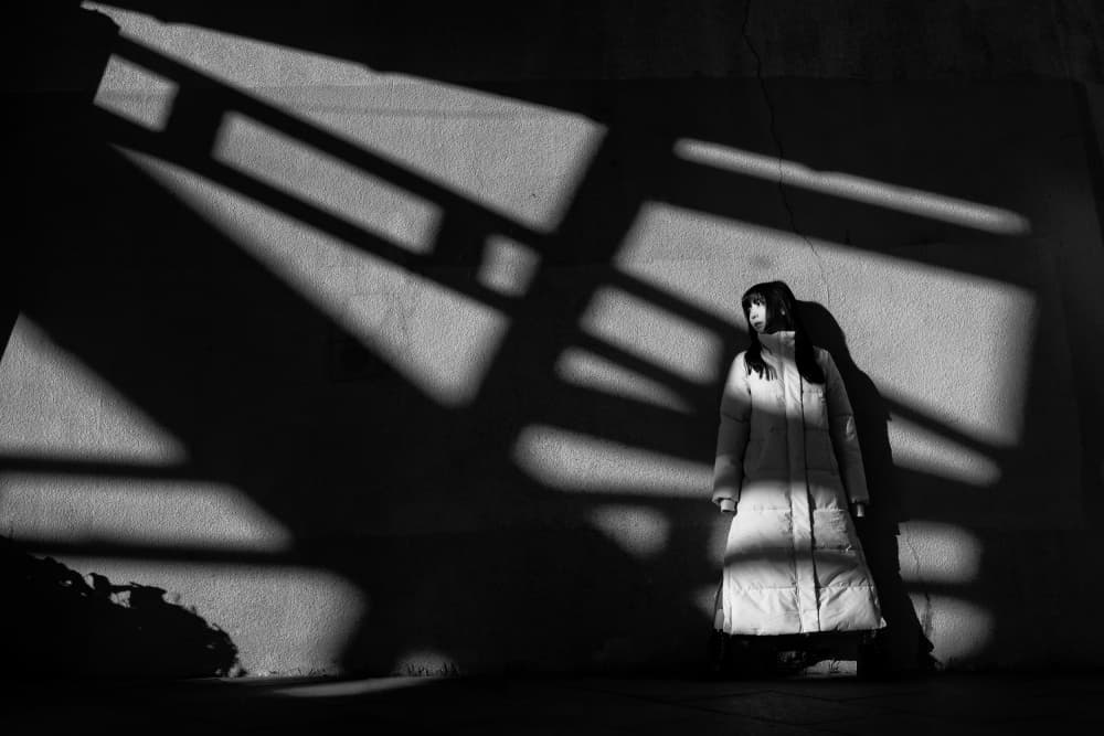 Woman in Dramatic Shadows by YASUTOSHI HONJO — canvas wall art