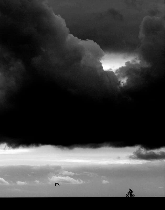 Stormy Sky Cyclist by Luciano Caturegli — canvas wall art