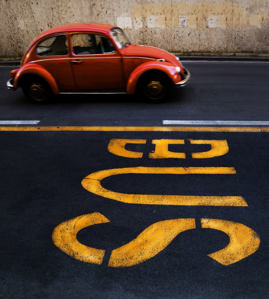 Red Beetle Bus Stop by Luciano Caturegli — canvas wall art