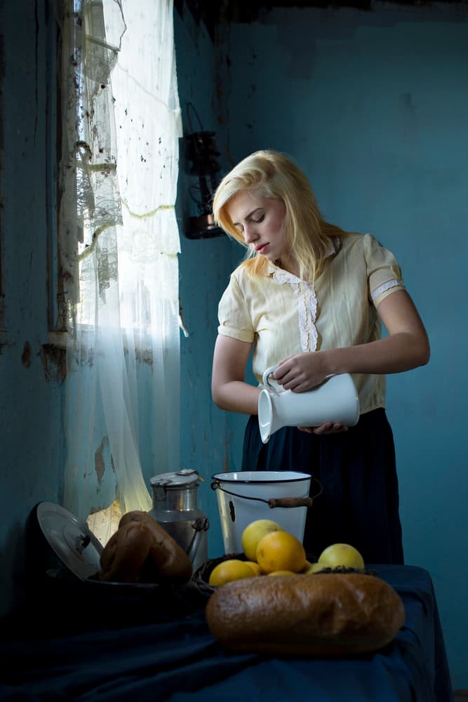 Blonde Woman Pouring Milk by Eyal Amer — canvas wall art