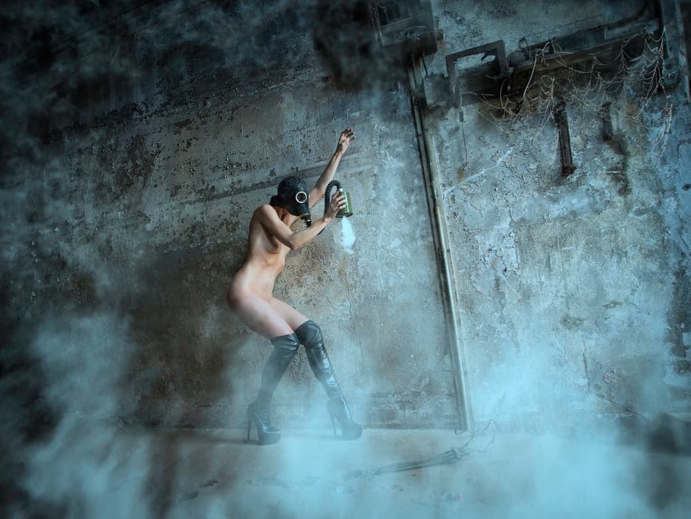 Gas Mask Woman Spraying by Catchlight Studio — canvas wall art