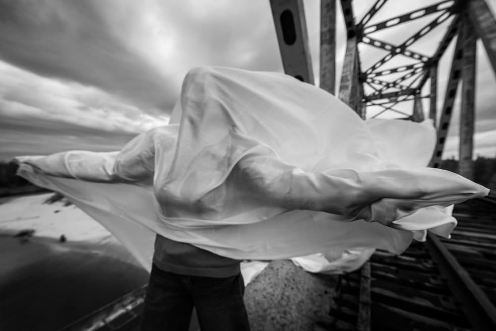 Mysterious Figure on Bridge by Andrey Snegirev — canvas wall art
