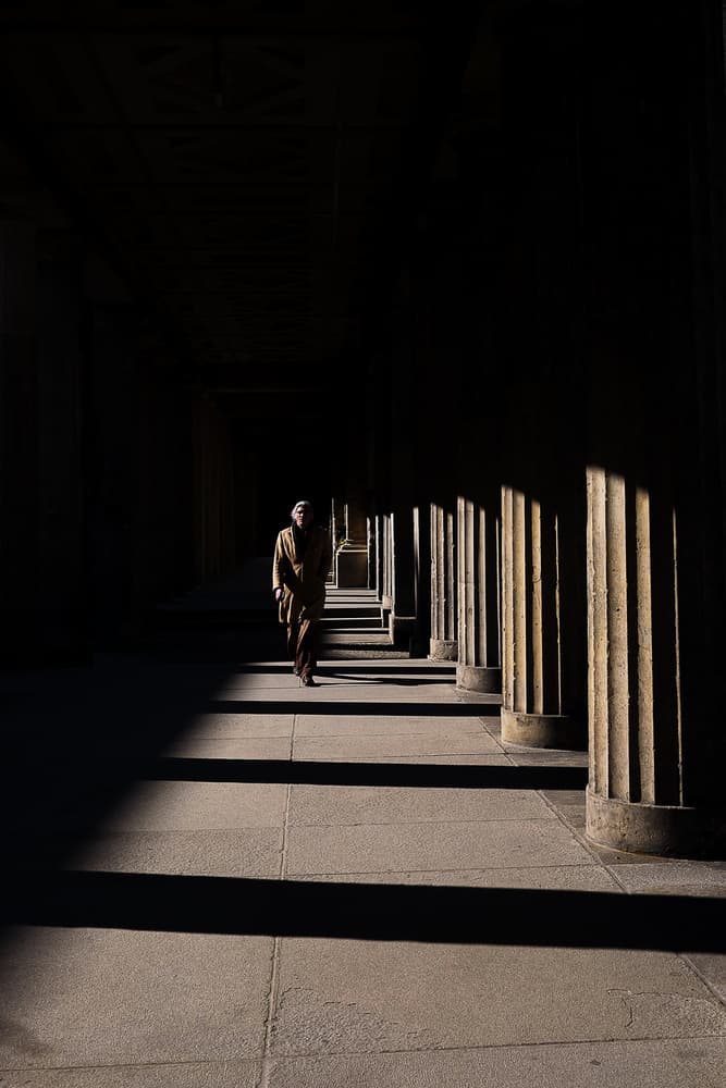 Lone Figure Sunlit Pillars by Enrico Finotti Re — canvas wall art
