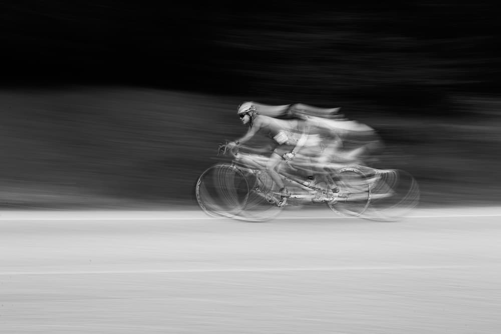 Blurred Cyclist Motion by Carlos Gonzalez — canvas wall art