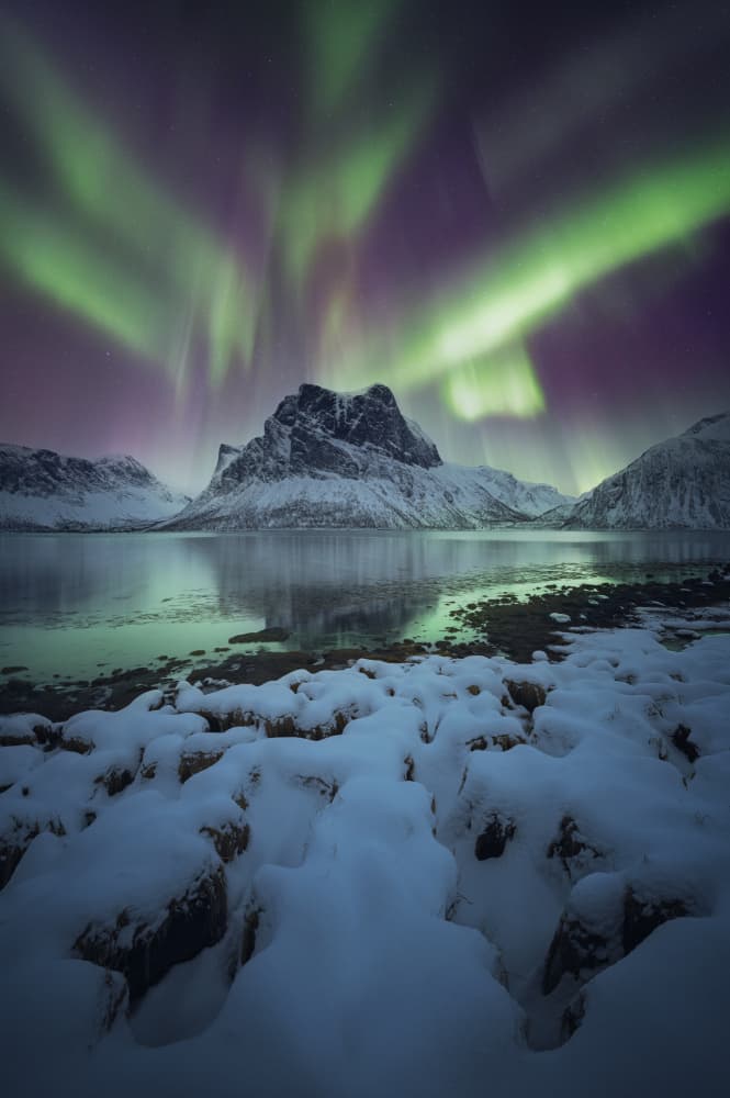 Northern Lights Over Snowy Mountains by David Martin Castan — canvas wall art