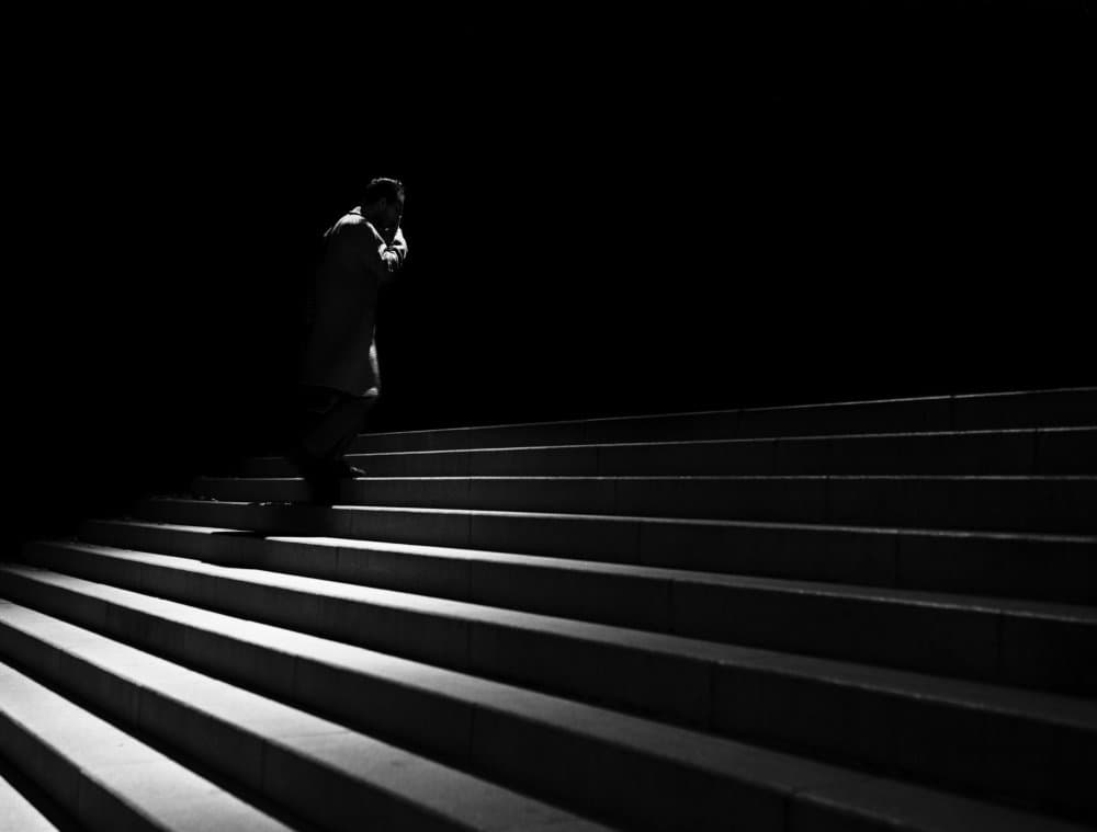 Man on Dark Stairs by Raul Ghiman — canvas wall art