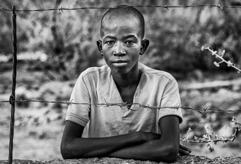 Boy Behind Barbed Wire by Joxe Inazio Kuesta Garmendia — canvas wall art