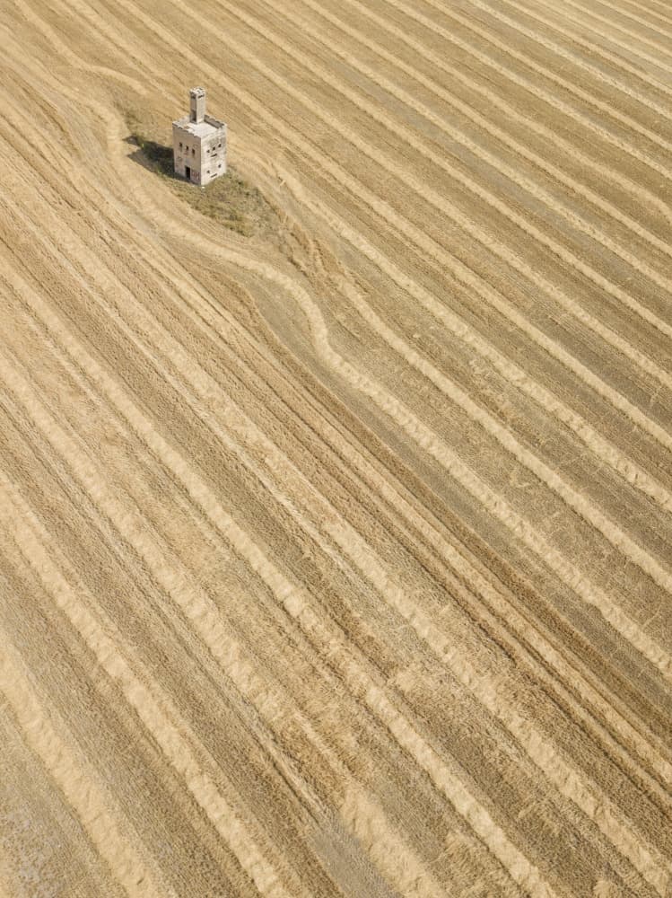 Stone Building Winding Fields by Felix Tchvertkin — canvas wall art