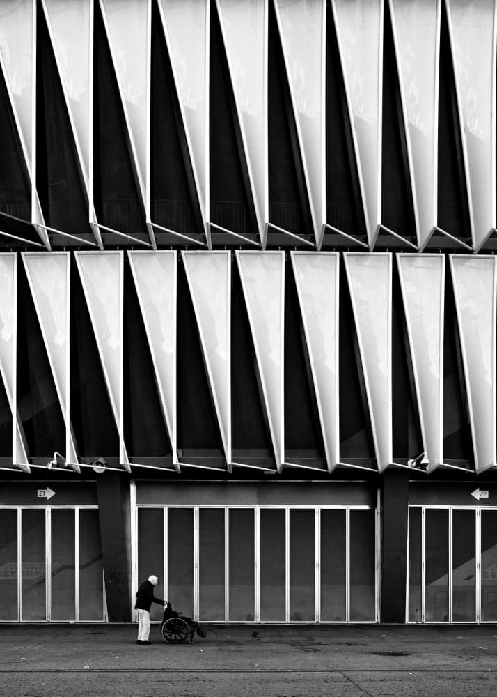 Urban Angles Wheelchair by Carlos Costa — canvas wall art