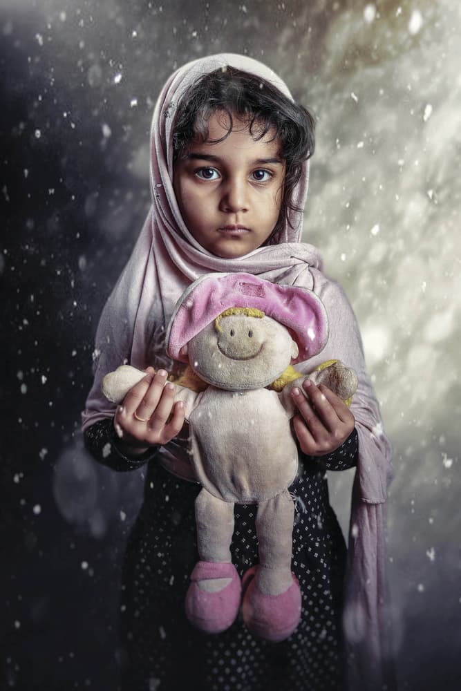 Innocent Girl With Doll by Husain ALSaeed — canvas wall art