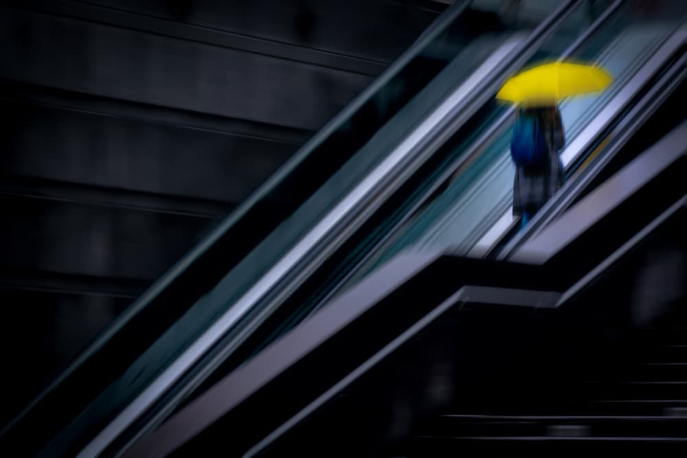 Yellow Umbrella Commute by Fengshou . Lin 林峰守 — canvas wall art