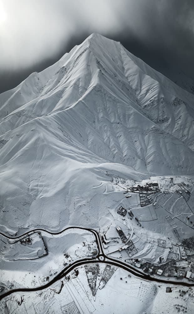 Snowy Mountain Village by Majid Behzad — canvas wall art