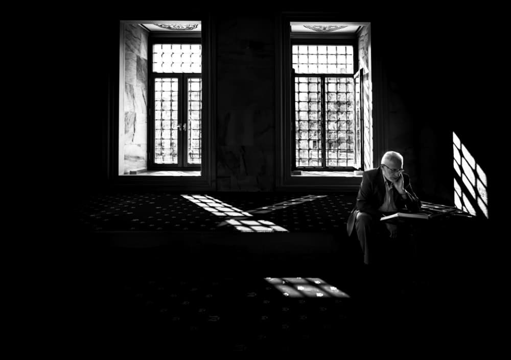 Man Reading in Shadows by Gulsen Yilman — canvas wall art