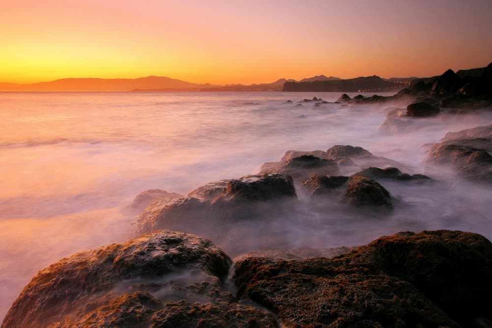 Misty Sunset Ocean Rocks by Paulo Jorge — canvas wall art