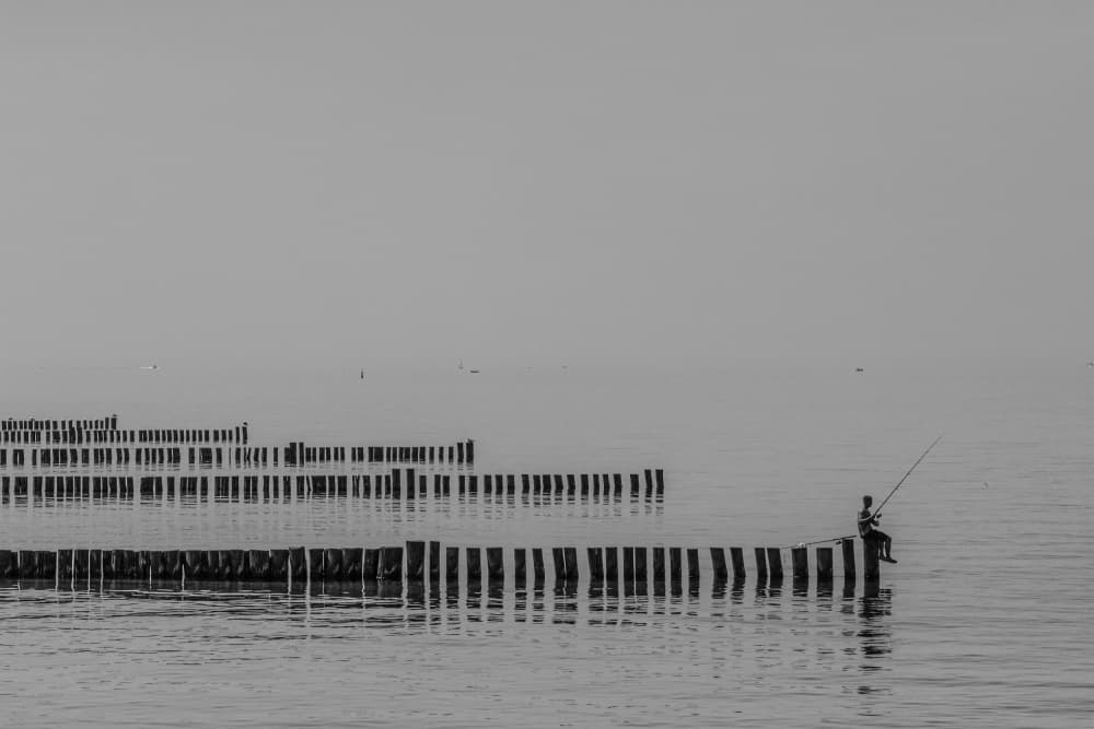 Solitary Fisherman Serenity by Kayanti Kootz — canvas wall art