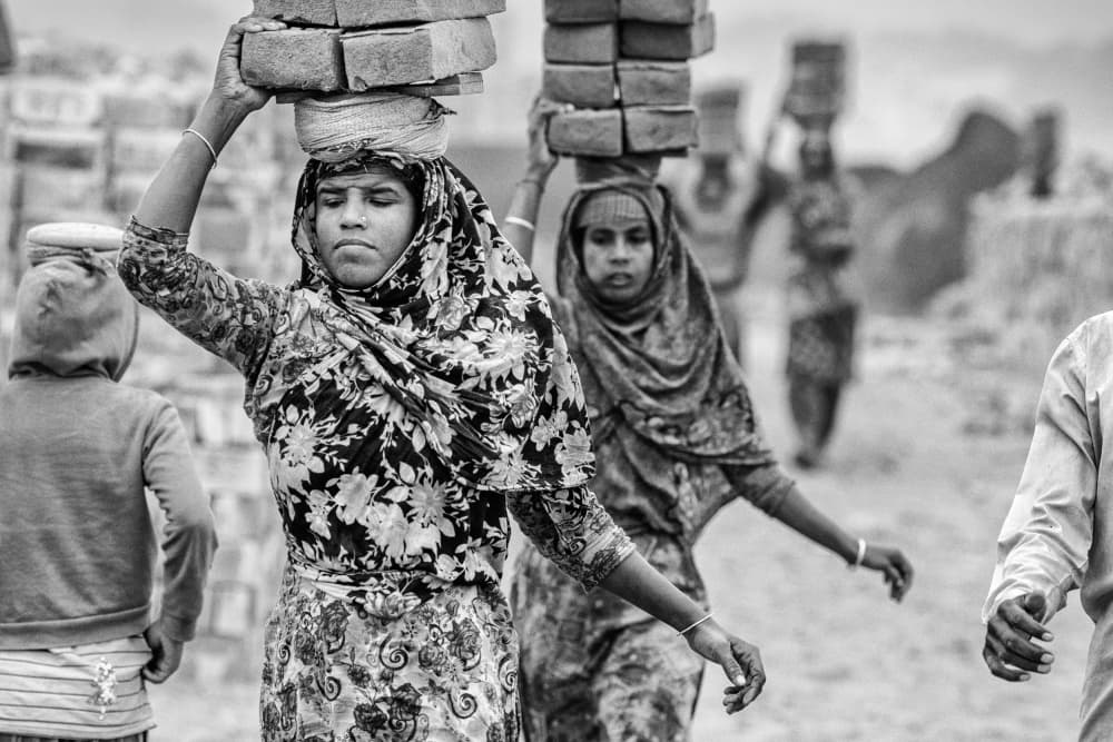 Women Carrying Bricks by Garik — canvas wall art