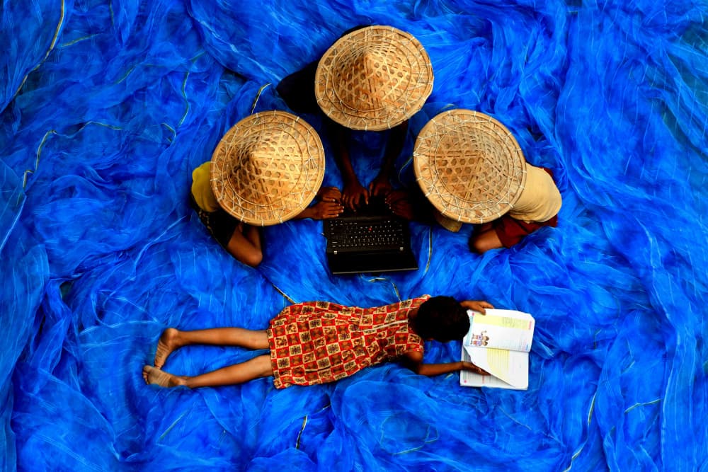 Children Learning Blue Nets by Avishek Das — canvas wall art