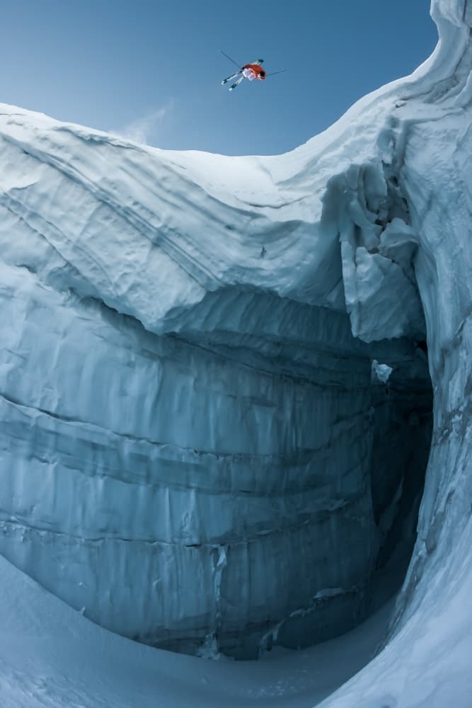 Skier Leaping Ice Chasm by Tristan Shu — canvas wall art