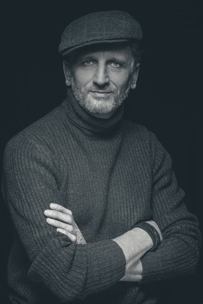 Confident Man in Cap by Dariusz Budyta — canvas wall art