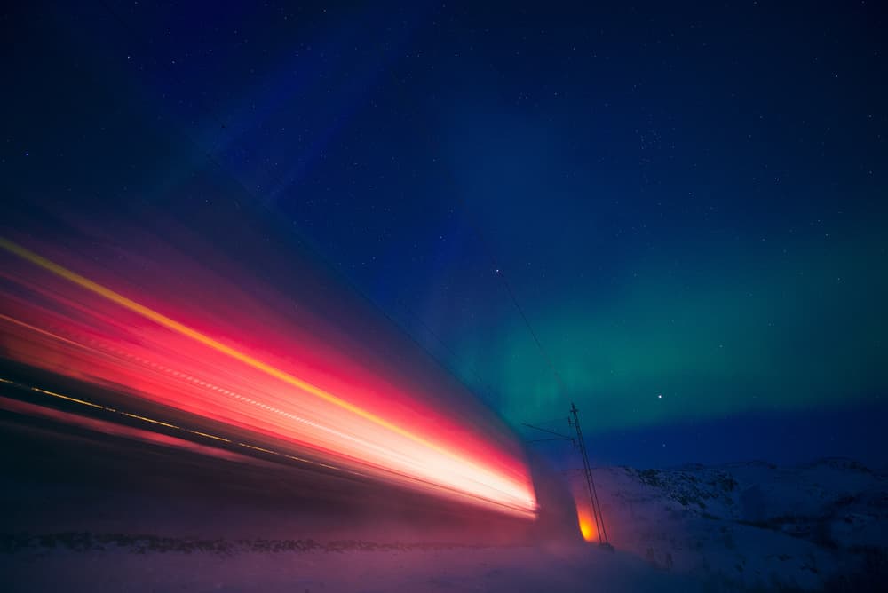 Light Trails Under Aurora by Fred Åge Hol — canvas wall art