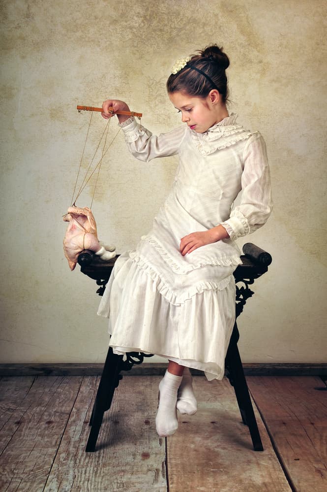 Girl And Chicken Puppet by Monika Vanhercke — canvas wall art