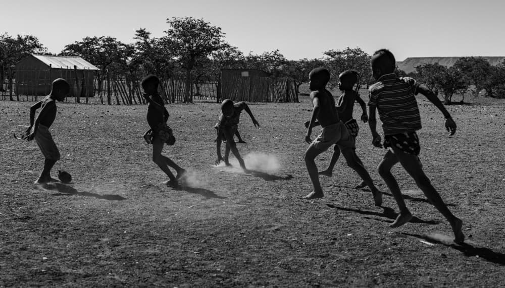 Children Playing Soccer by Mei Shi — canvas wall art