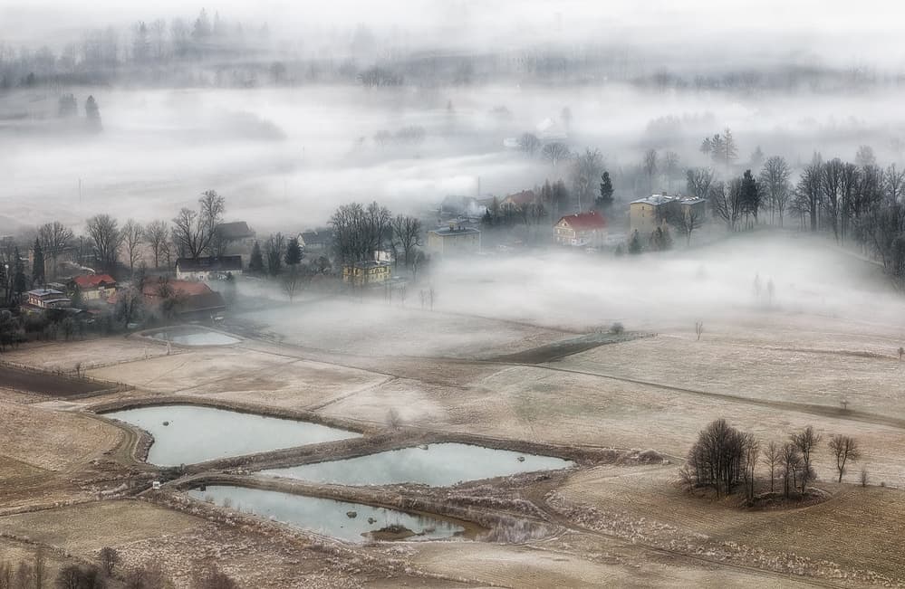 Misty Winter Village by Piotr Krol (Bax) — canvas wall art