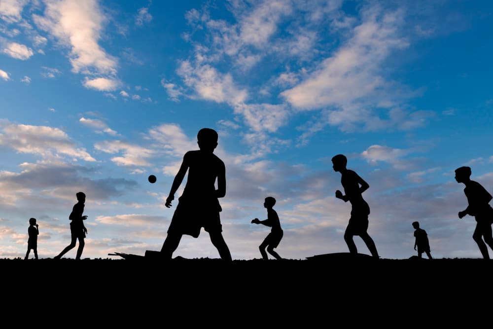 Boys Playing At Sunset by Kuntal Biswas — canvas wall art