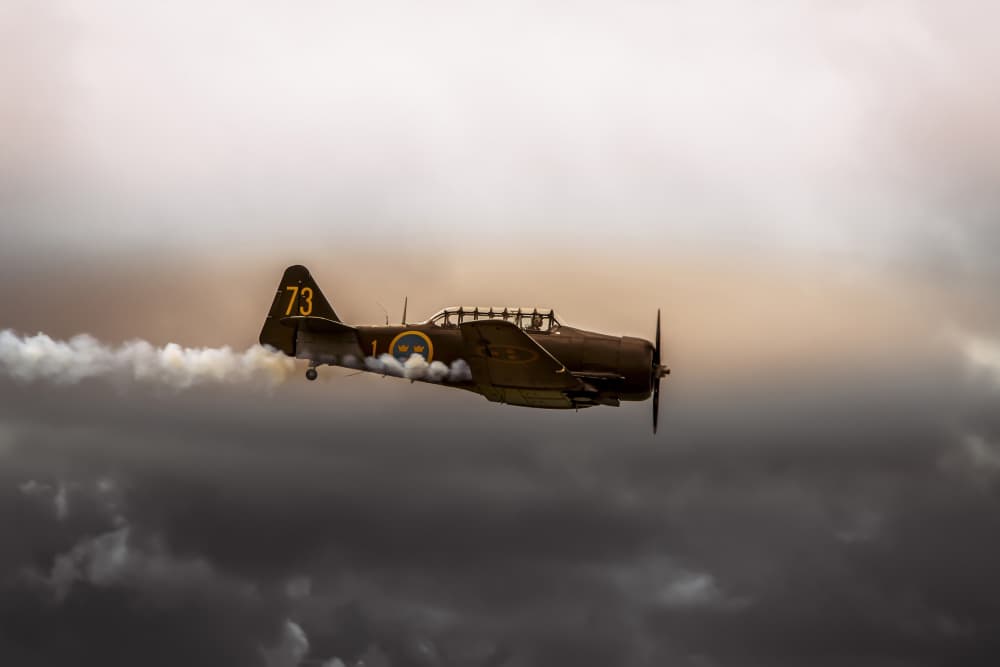 Vintage Plane Smoke Trail by Jørgen Wicklow — canvas wall art