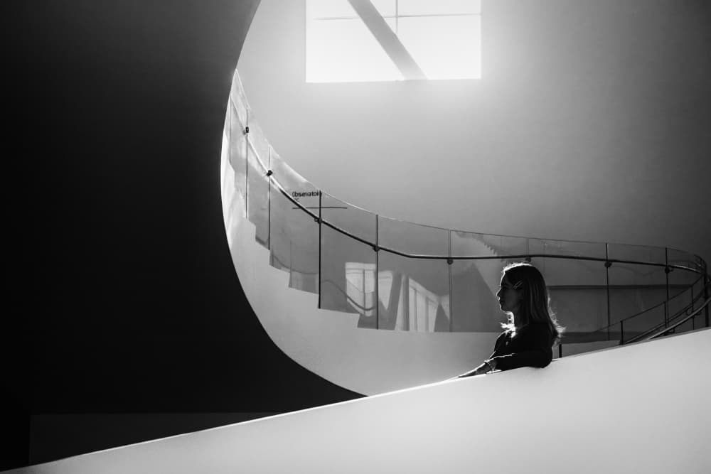 Woman And Curved Stairs by Michel Groleau — canvas wall art