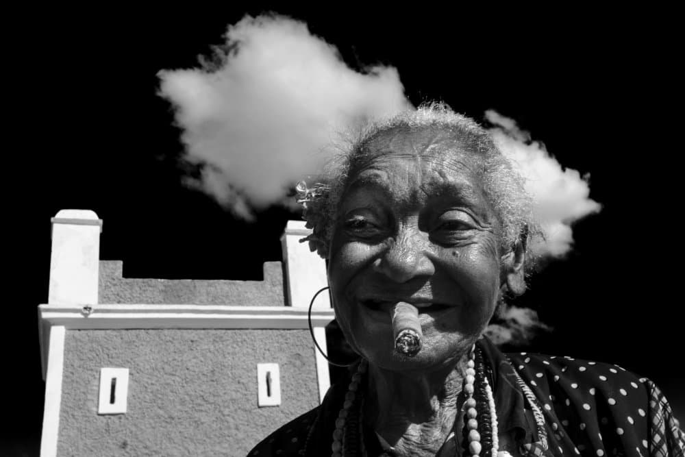 Smiling Elder Cigar by Orna Naor — canvas wall art