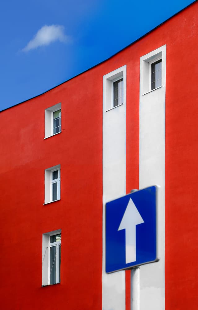 Red Building Upward Arrow by Anna Niemiec — canvas wall art