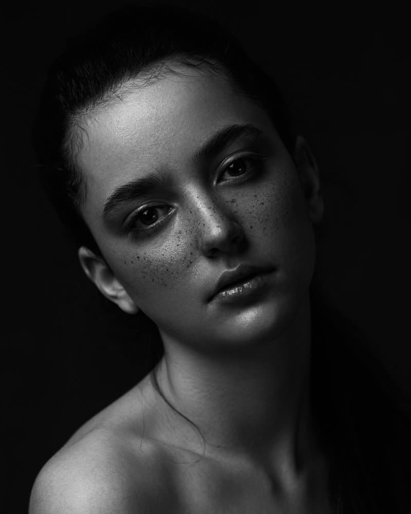 Moody Freckled Woman by Ali Sahebi — canvas wall art