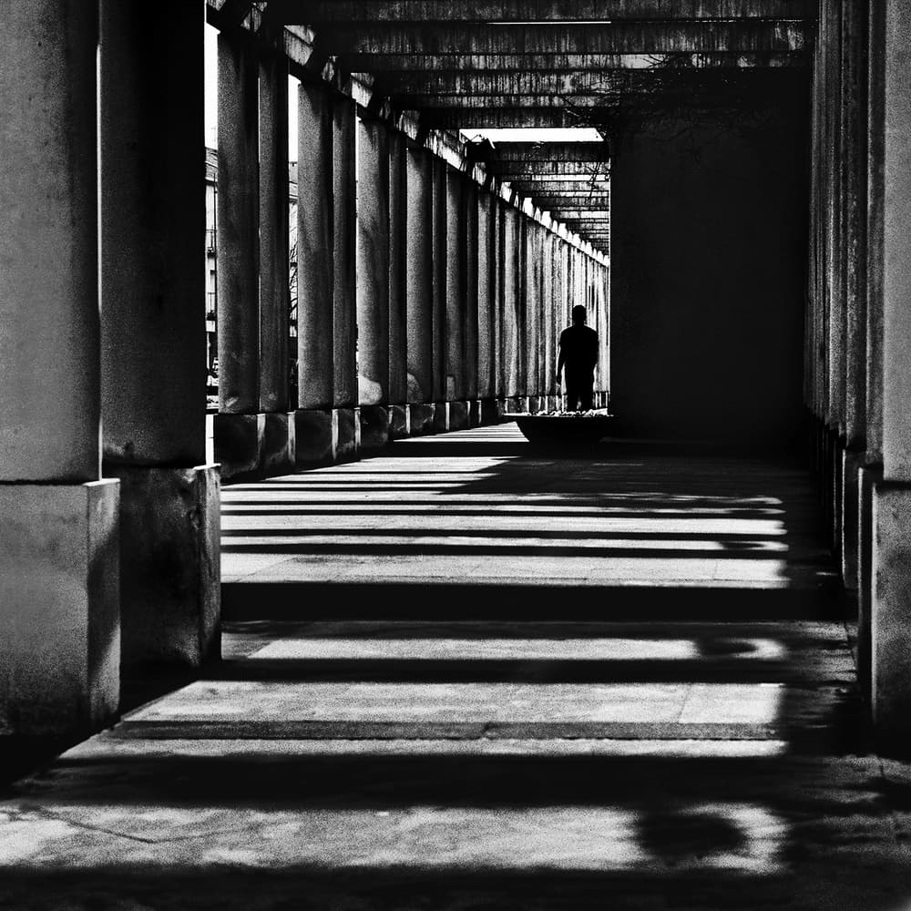 Man in Shadowed Corridor by Paulo Abrantes — canvas wall art