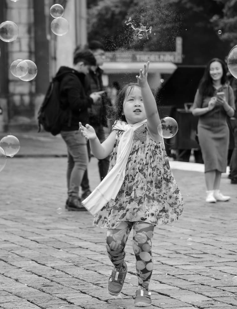 Happy Child Bubble Play by Itzik Einhorn — canvas wall art