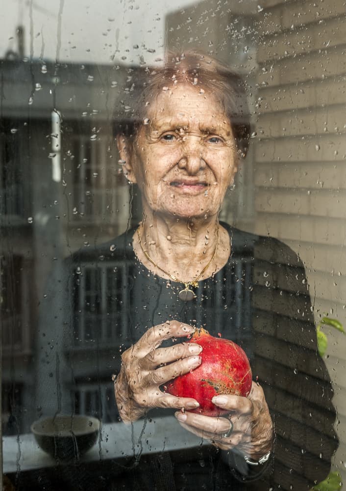 Woman Pomegranate Rainy Day by Mitra Bahmani — canvas wall art
