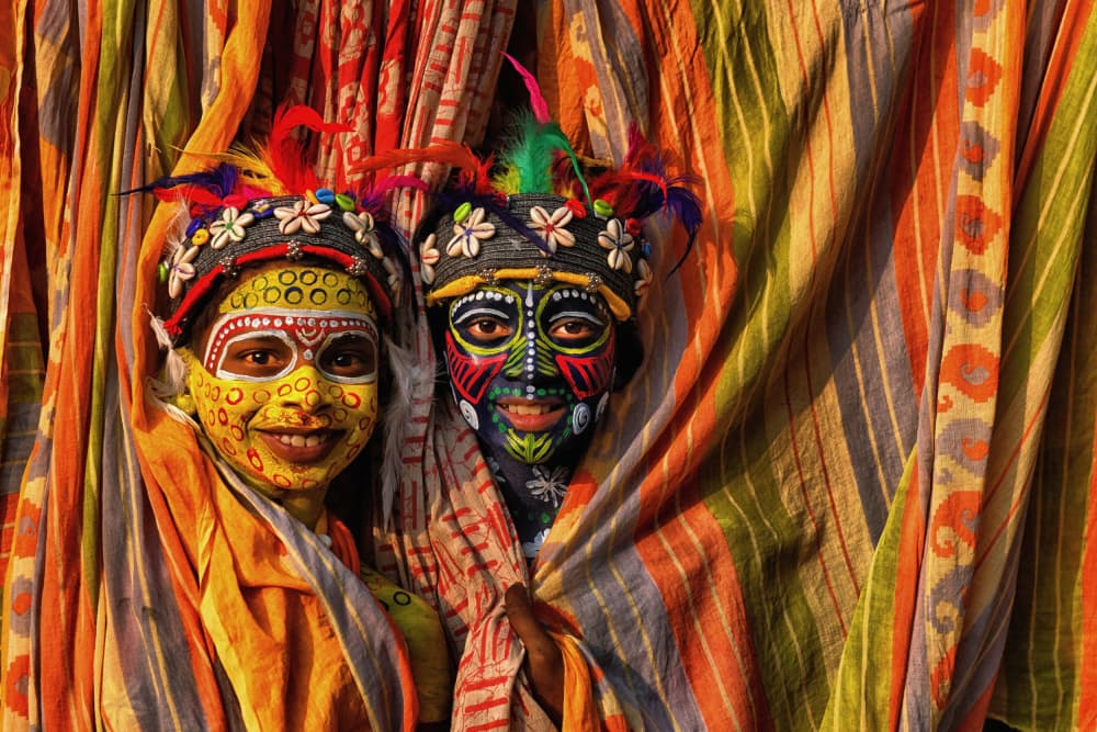 Vibrant Painted Faces by Avishek Das — canvas wall art