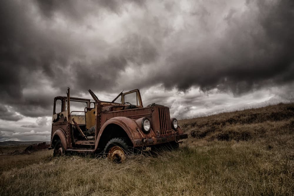 Rusty Jeep Stormy Sky by Þorsteinn H. Ingibergsson — canvas wall art
