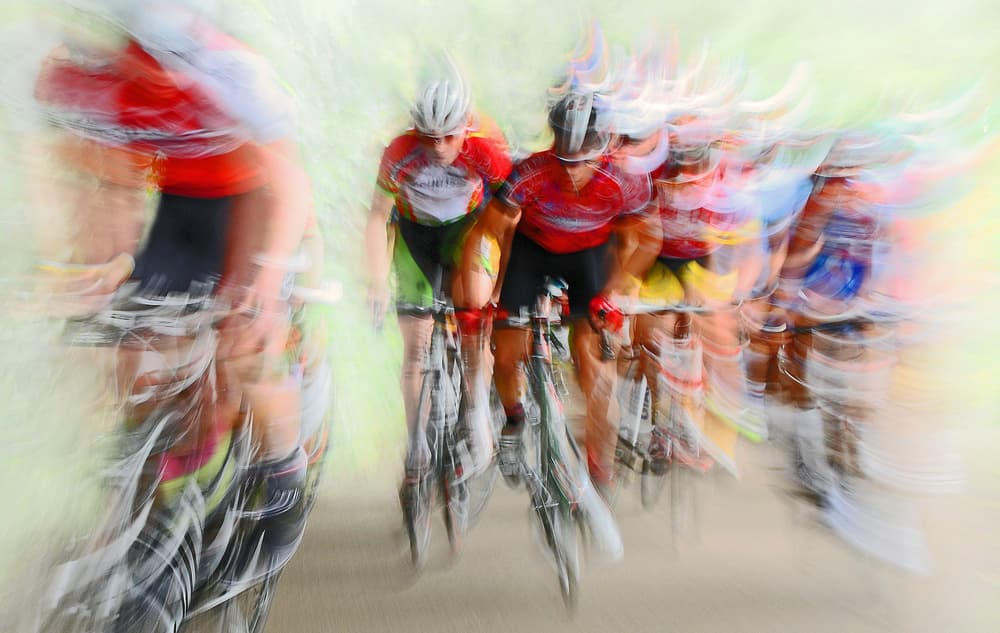 Speeding Cyclists Blur by Lou Urlings — canvas wall art