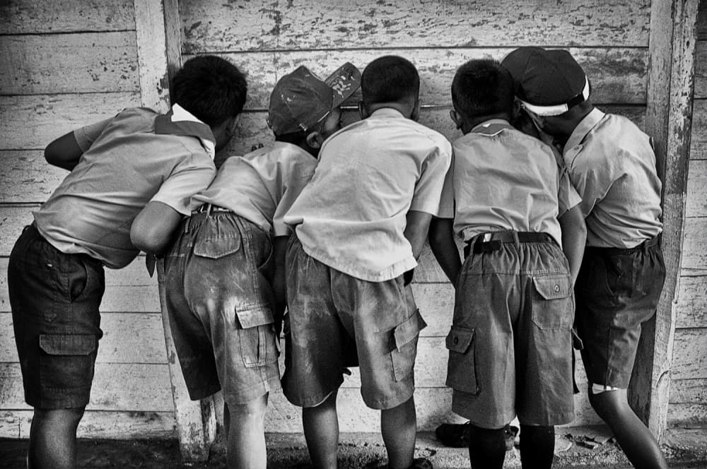 Curious Boys Peering by Joey Bangun — canvas wall art