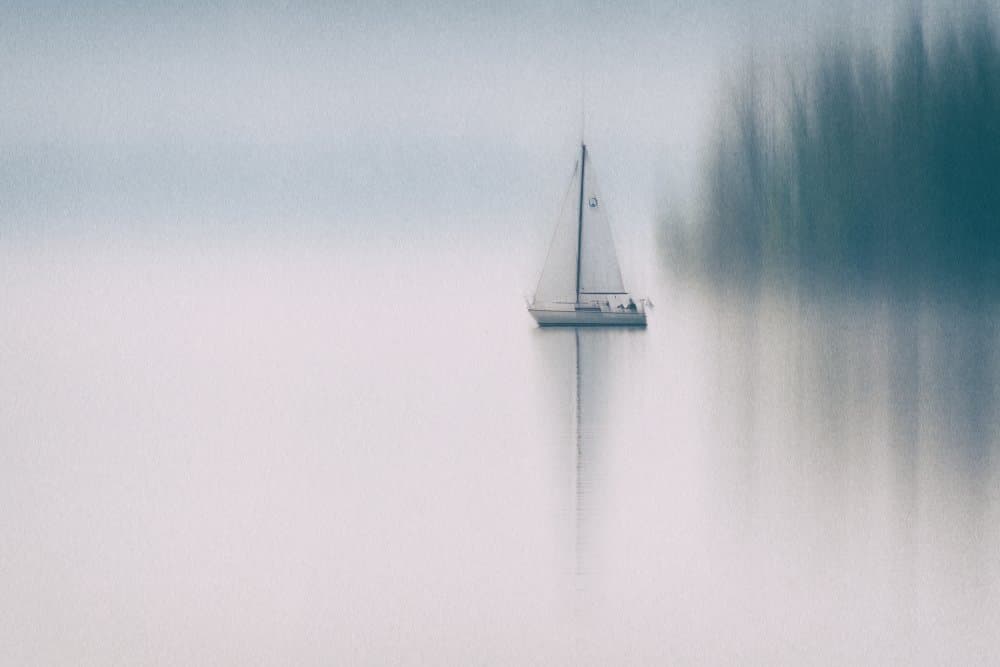 Sailboat on Misty Lake by Roswitha Schleicher-Schwarz — canvas wall art