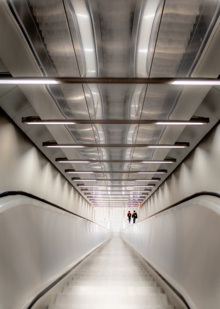 Long Escalator Journey by Andy Dauer — canvas wall art