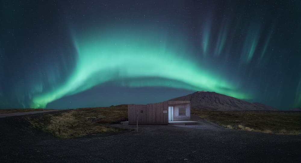Cabin Under Northern Lights by Juan Romero Salamanca — canvas wall art