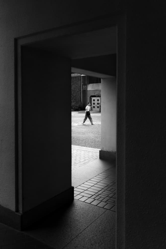 Man Walking Through Archway by HISASHI ISHIKAWA — canvas wall art