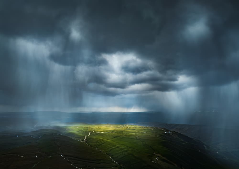 Sunlit Storm Over Hills by Yuhan Liao — canvas wall art