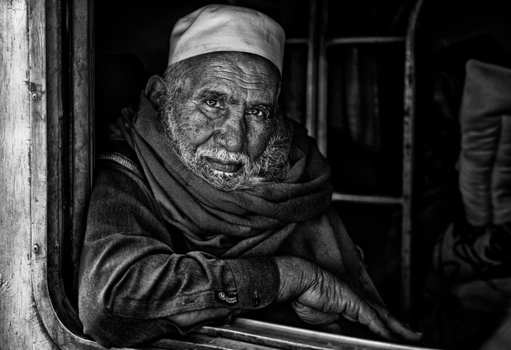 Elderly Man in Train by Joxe Inazio Kuesta Garmendia — canvas wall art