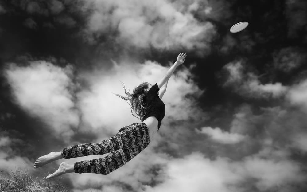 Joyful Leap For Frisbee by Gloria Salgado Gispert — canvas wall art