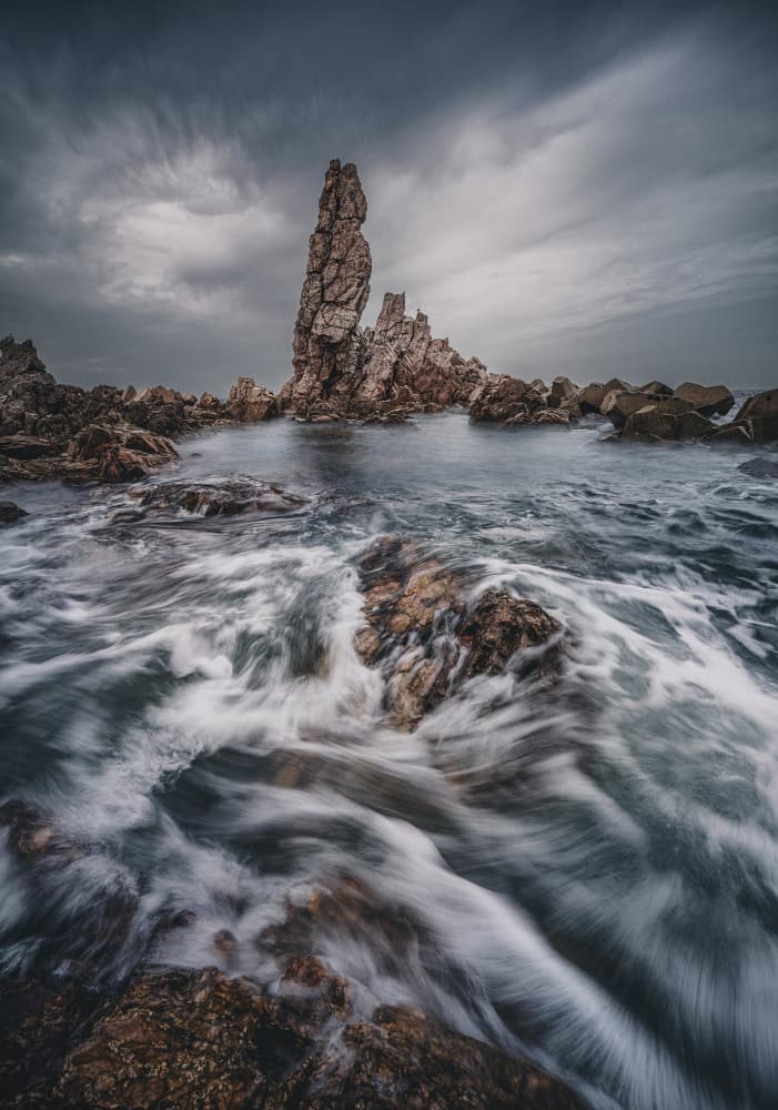 Moody Sea Stack Coast by YANGYING — canvas wall art
