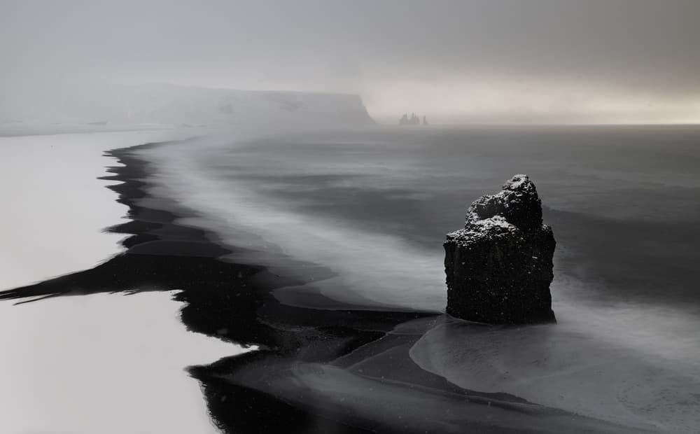 Dark Winter Sea Stack by Roberto Marchegiani — canvas wall art