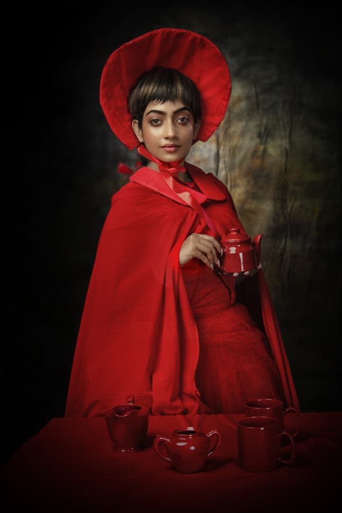 THE GIRL WITH RED TEA SET by PARTHA BHATTACHARYYA — canvas wall art